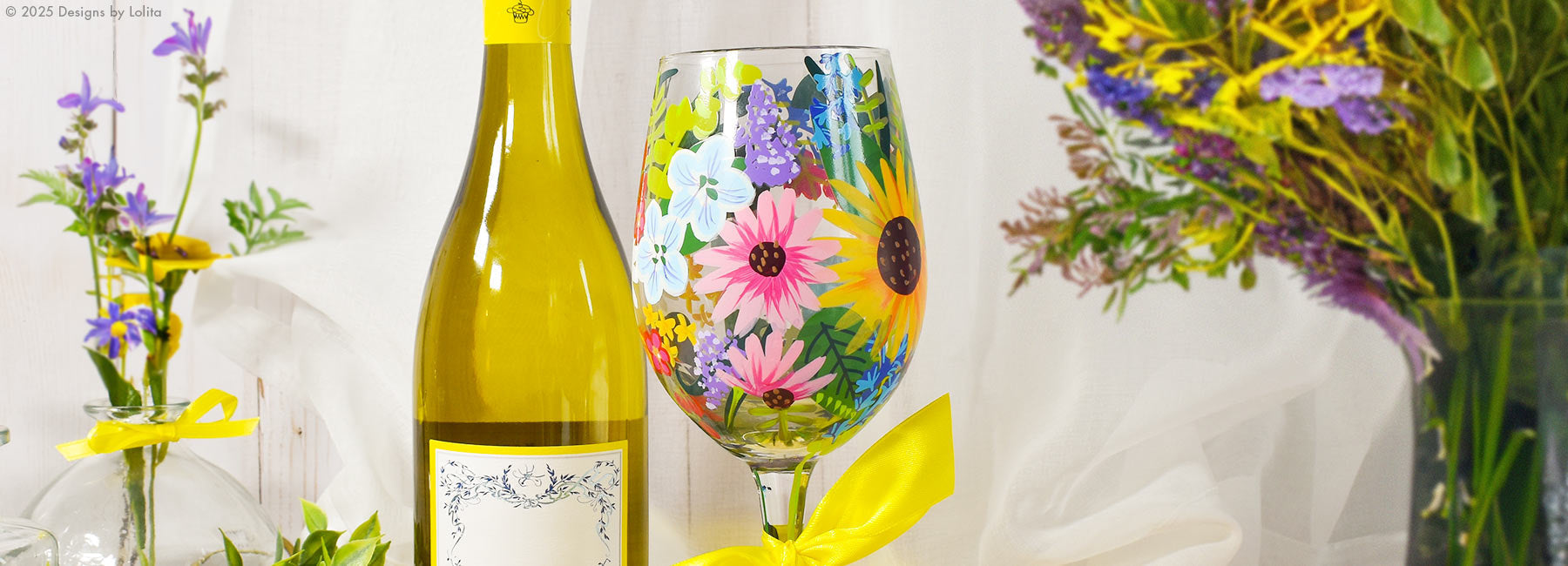 Lolita's Floral Glass next to Wine Bottle