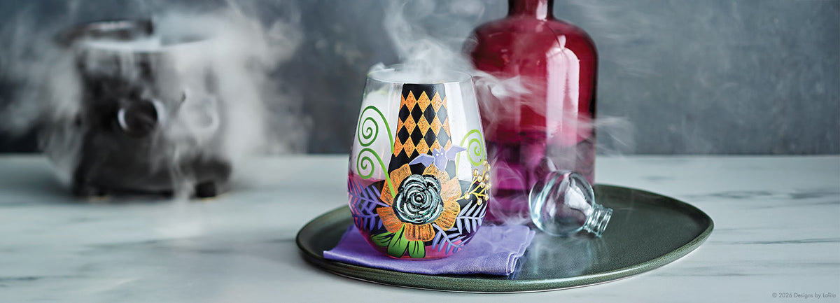 My Fancy Witch Hat stemless wine glass with dry ice smoke coming out of it