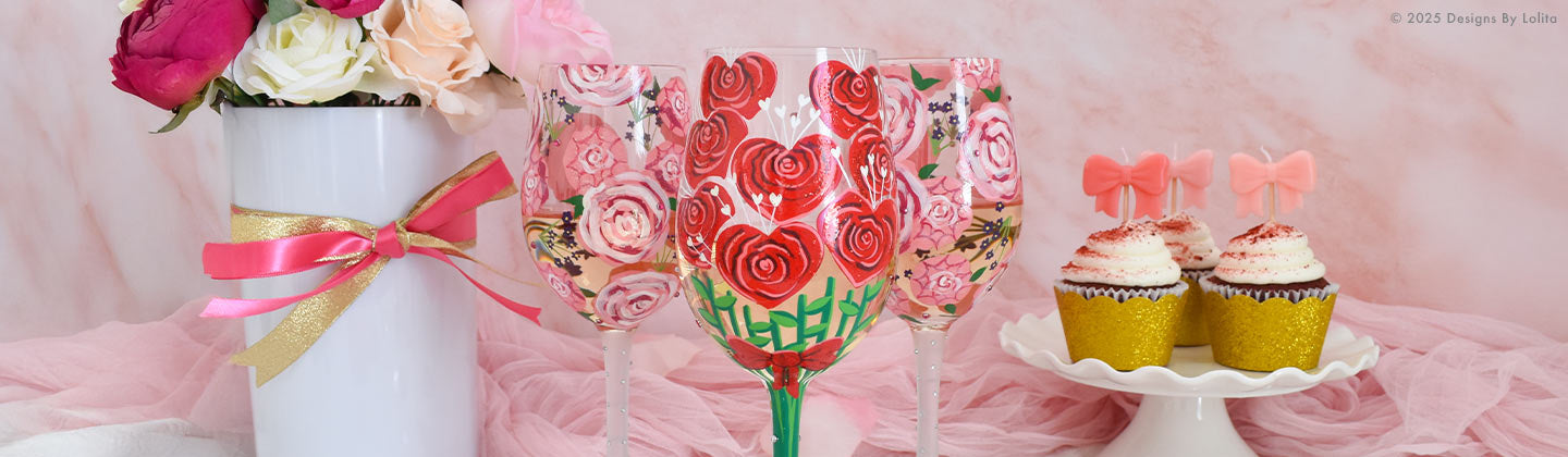 Vase with roses, heart wine glass, and cupcakes