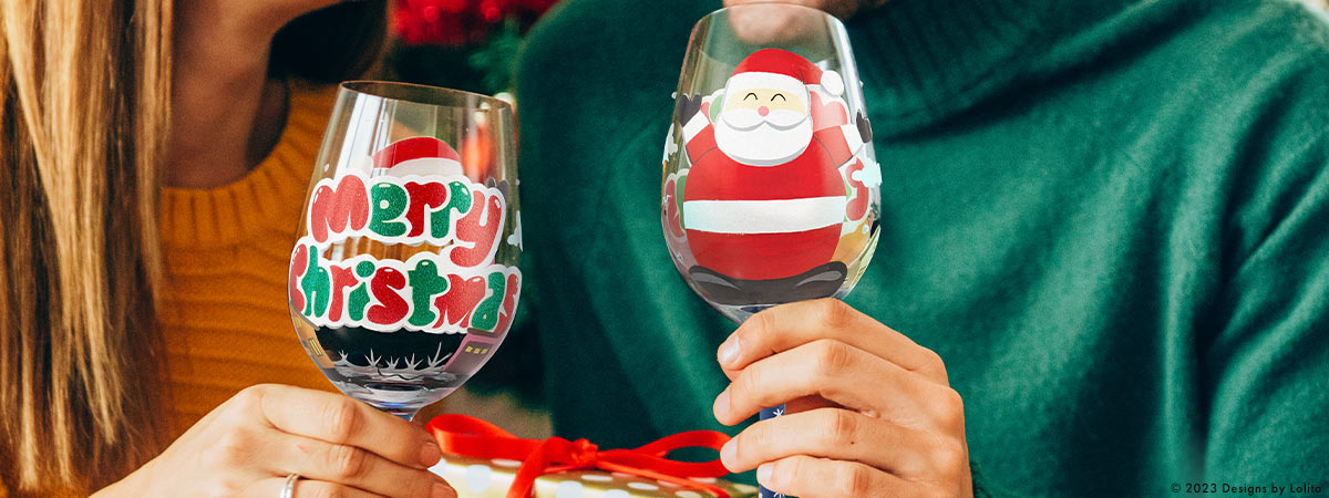 Two people holding holiday glasses