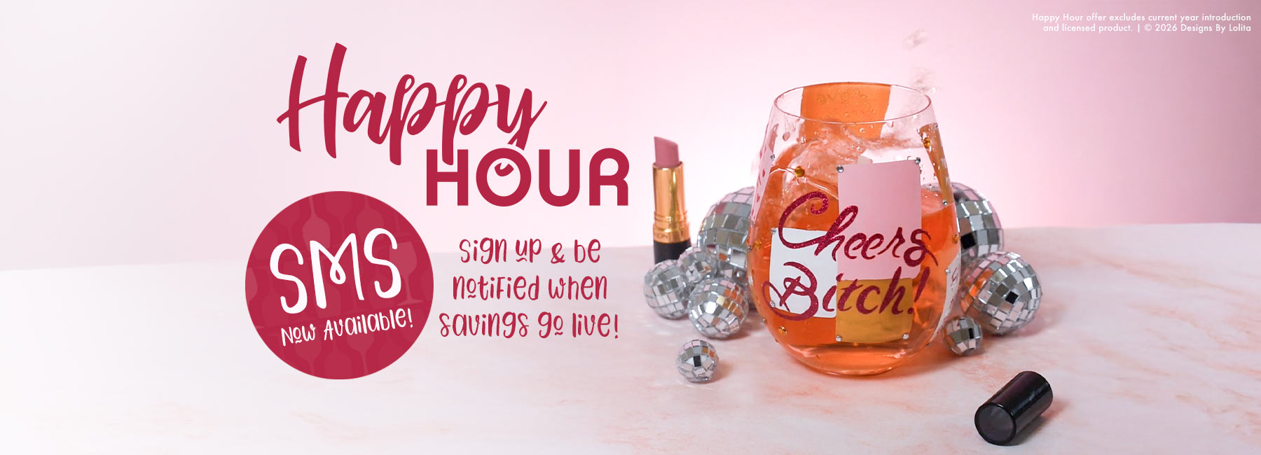 Decorative glass with 'Cheers Bitch' text, lip gloss, and 'Happy Hour SMS' sign on a pink background